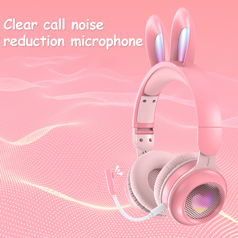 Pink wireless rabbit ear headphones with clear call noise reduction microphone and soft cushions.