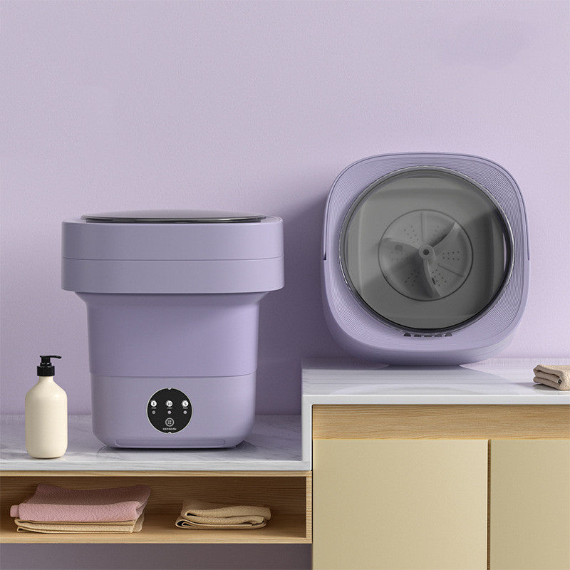 Mini Foldable Washing Machine in lavender color displayed on a countertop, showcasing its compact design for easy use.