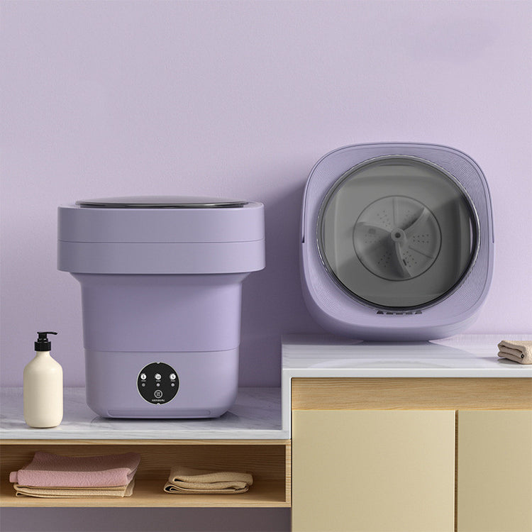 Mini Foldable Washing Machine in lavender color displayed on a countertop, showcasing its compact design for easy use.