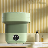 Mini Foldable Washing Machine in green color on a countertop with stylish background.