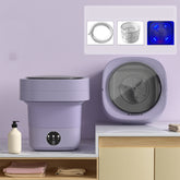 Mini Foldable Washing Machine displayed on a countertop, showcasing its compact design and accessories.