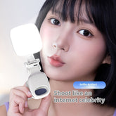 Mobile Selfie Fill Light attached to a phone illuminating a young woman&