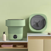 Mini Foldable Washing Machine displayed in a modern setting, showcasing its compact and stylish design for portable laundry.